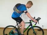 Fig. 2: Test subject on a bicycle ergometer. The MSR147WD data logger is attached to the arm. Image source: VAUDE Sport GmbH & Co. KG